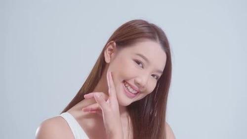 Portrait of beautiful asian woman over white background studio