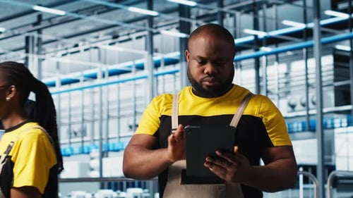 Engineer Overseeing Solar Panels Smart Factory Equipment