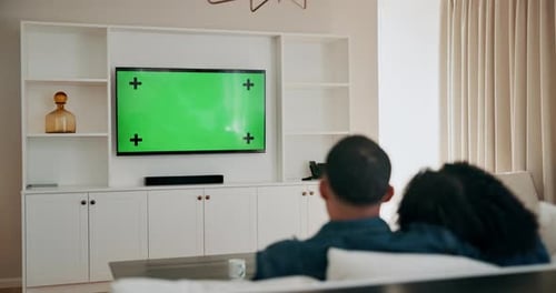 Couple, television and green screen to watch movies in home, subscription and streaming cinema