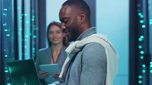 Data Center Engineers Analyzing Computer System