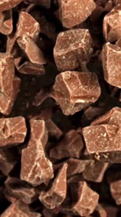 Super Slow Motion Pieces of Dark Milk Chocolate Filmed on a Highspeed Camera at 1000 Fps