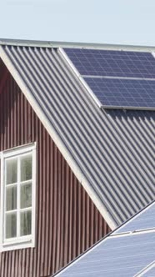 Solar panels mounted on roof of building, renewable energy source