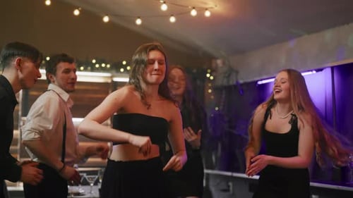 Girl Dancing in a Club in the Crowd Friends Cheerful Students Dancing Having Fun Celebrate Holiday
