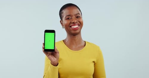 Face, woman and advertising green screen of phone, UX space or newsletter in studio on white