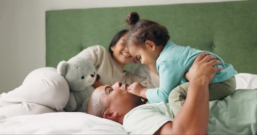 Family Fun and Playtime Together on the Bed