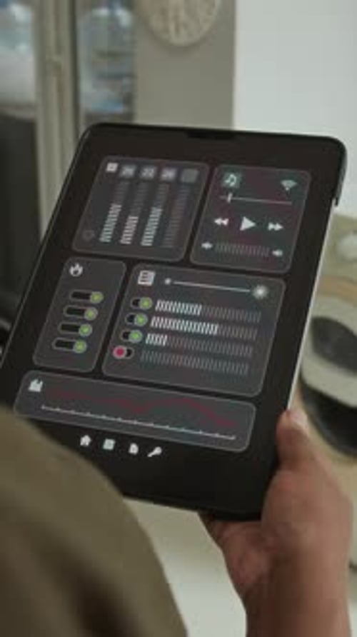 Hand Holding Tablet with Smart Home Interface