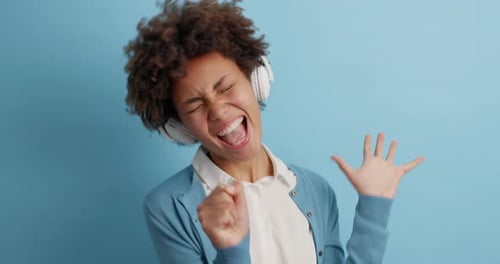 Woman Listening to Music and Dancing Happily