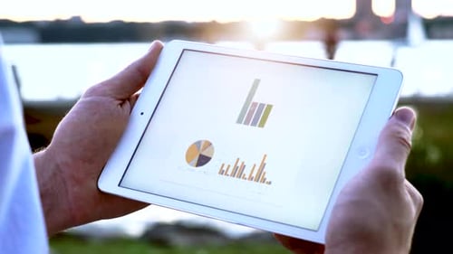 Person Using Digital Tablet Screen Accounting Business Profits Data Charts