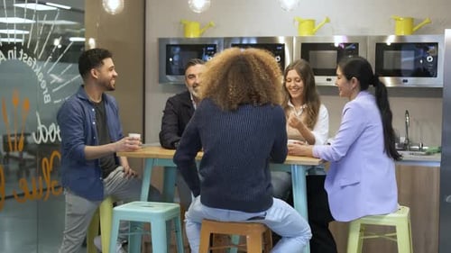 Team Meeting Around Table in Modern Workplace
