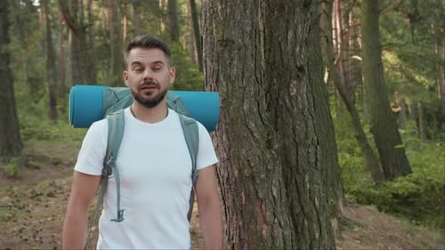 Close Up Handsome Young Man Hiker Standing in the Forest Look Around at Sunlight Nature Alone Hiking
