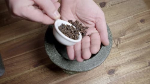 Crushing Fresh Peppercorns with Mortar and Pestle