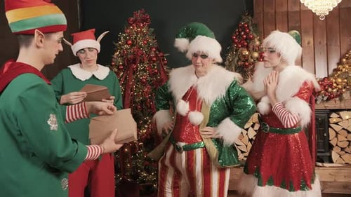 Festive Elves Reading Christmas Letters by Fireplace