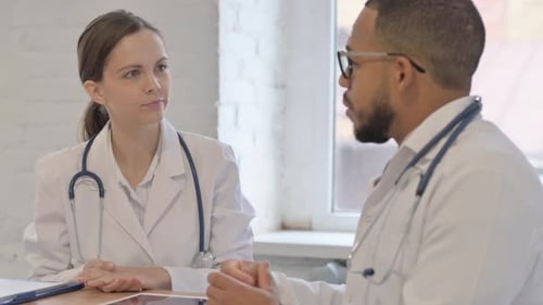 Team of Multi Ethnic Doctors Talking in Hospital