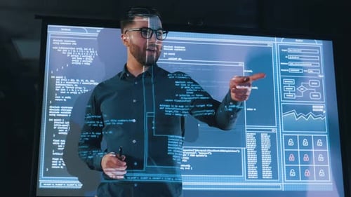 Male business trainer is against projector with data, teaching people.