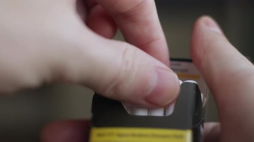 A Man's Hand Opens a Pack and Pulls Out a Cigarette Bad Habit Nicotine Addiction Harm to Health