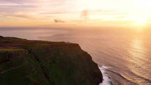 Stunning aerial view of dramatic coastline at sunset highlighting natural beauty