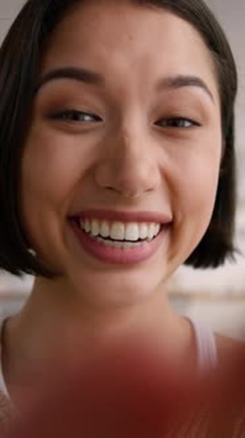 POV Webcam Happy Caucasian Woman at Home Smiling Texting Typing on Mobile Phone Point of View Joyful