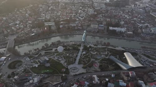 Aerial view of Tbilisi city central park and Bridge of Peace. Beautiful cityscape of old Tbilisi