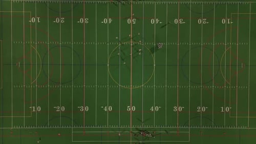Aerial Top Down Wide View of American Football Teams of Play at Night Time