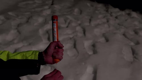 Man demonstrating how to launch maritime emergency flare, close up slow motion.