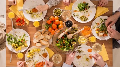 Family Meal Together Overhead at Dining Table