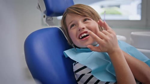 Kid Sitting Dentistry Appointment in Pediatric Clinic Closeup Little Patient