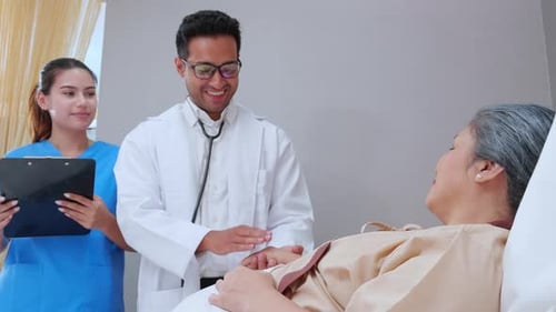 Specialist doctor man and nurse explaining and check with elderly patient in hospital.