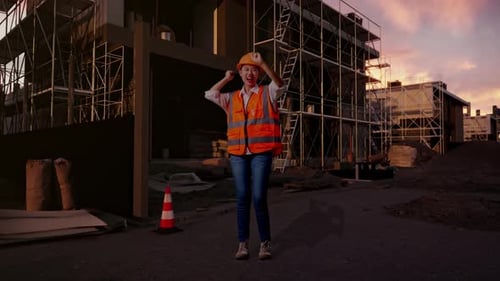 Full Body Of Asian Female Engineer Screaming Goal And Dancing Celebrating At Building Site