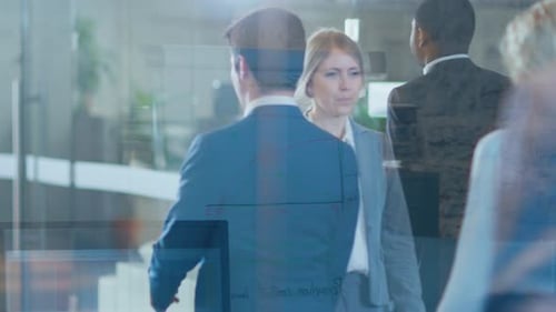 Through the Glass Shot of Resolute Business People Walking Through the Corporate Building Hallway.