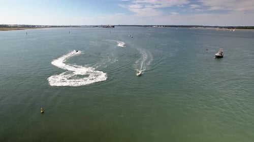 Motorboats Making Wakes On The Waters Of The Solent In Calshot, UK In Summer. wide aerial