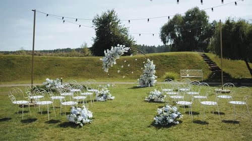 Idyllic Wedding Venue with Floral Arch and Chairs