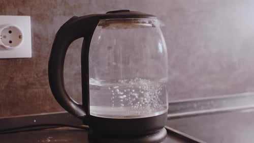 Close Up of Electric Kettle Water Heating and Bubbling