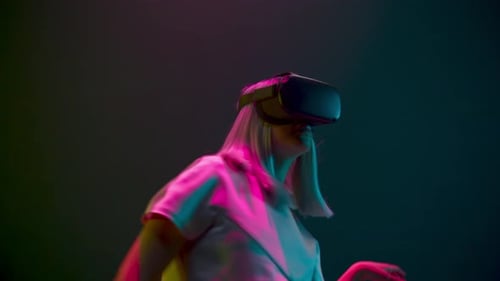Woman wearing VR headset and moving hands