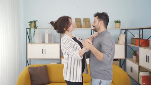 Loving Couple Dancing Together at Home