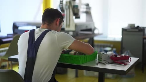 Electrician Assembles Electrical Panel Fuse Box in Workshop Worker Installs Energy Meter Switches