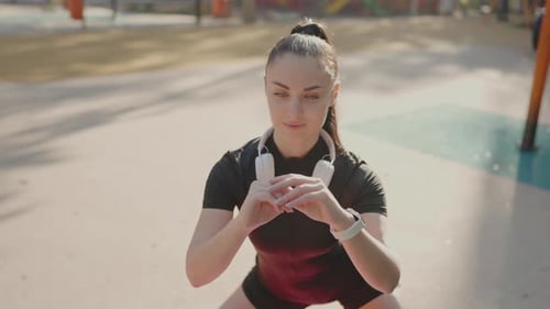 Athletic Woman Exercising Outdoors on Sunny Day