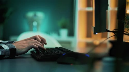 Slow motion close-up shot of male hands writing on desktop computer keyboard. Copywriter or blogger