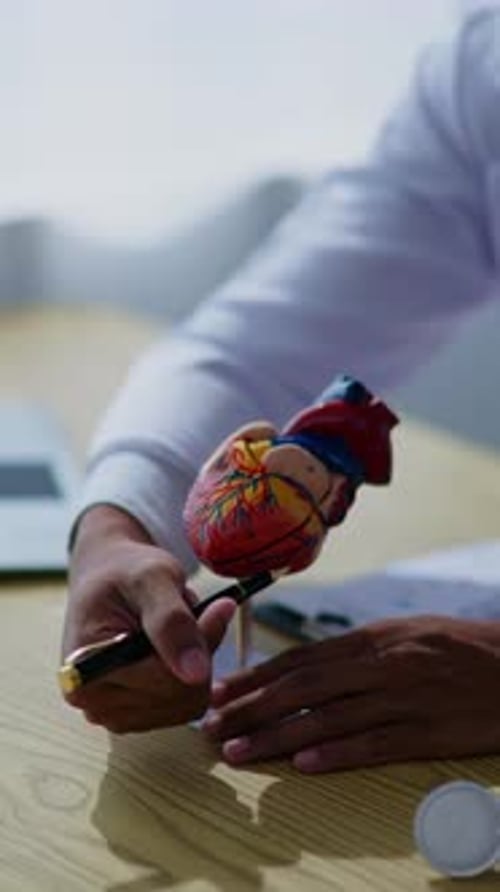 Doctor explaining about sickness and disease to patient and medical studeent in hospital