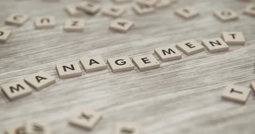 Scrabble Tiles Spell Out Management