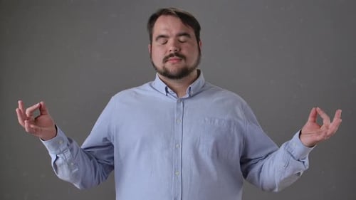 Bearded Man Practicing Yoga and Meditation