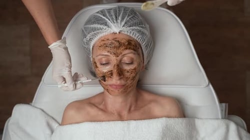 Woman Receives Facial Mask in Spa Treatment