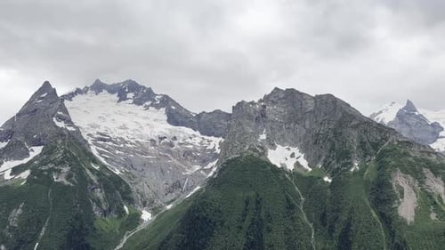Exploring Majestic Mountain Peaks in Cloudy Weather Generative AI
