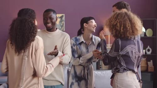 Multiethnic Friends Chatting at Party in Apartment