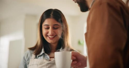 Woman Laughing While Being Offered Coffee