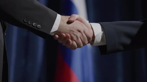 Handshake Between Businessmen at International Meeting