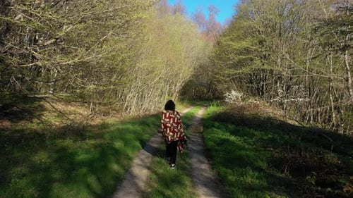 Girl Walking On Forest Trail With Trees At Daytime Near Tbilisi In Georgia. - follow shot