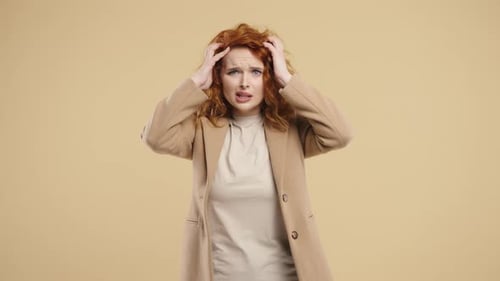 Woman with Red Hair is Stressed and Upset