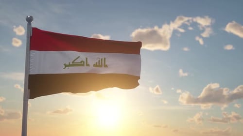 Realistic Iraq National Flag Waving in Wind with Sunset