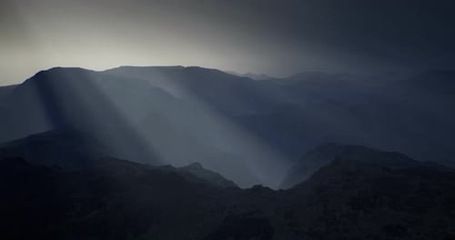 Majestic Mountain Landscape Illuminated By Soft Rays of Sunlight During Dusk