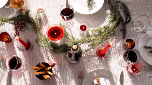 Festive Table Setting with Candles and Wine